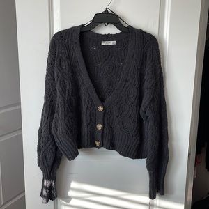 A cute cropped cardigan, it’s barely worn and looks and feels brand new.